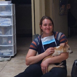 dvm student sitting on floor with patient